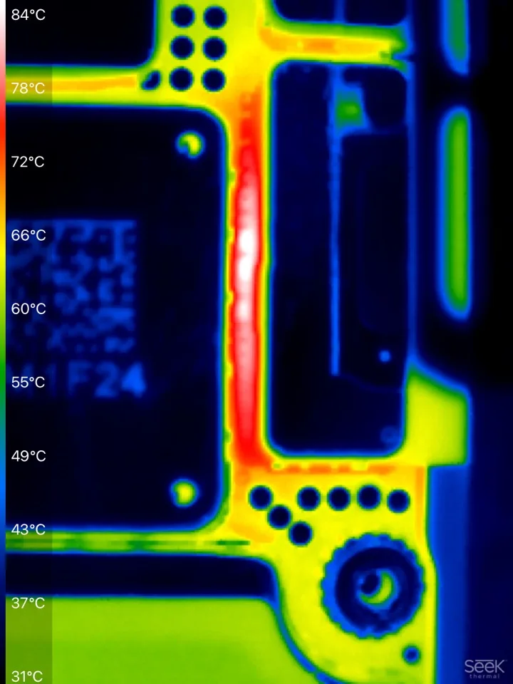 Thermal camera view of a circuit board, with a bright area of concentrated heat